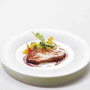 沖縄県産あぐー豚ロースの低温調理 香味野菜とイカ墨のソース